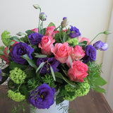 Flowers used: purple lisianthus, pink roses and, green viburnum