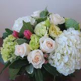 Flowers used: cream roses, white and green hydrangeas, pink tulips, chartreuse lisianthus