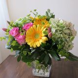 Flowers used: pink roses, yellow gerberas, pink tulips, rustic green hydrangeas, chartreuse lady's mantle