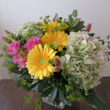 Flowers used: pink roses, yellow gerberas, pink tulips, rustic green hydrangeas, chartreuse lady's mantle