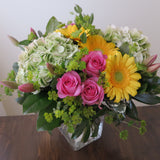 Flowers used: pink roses, yellow gerberas, pink tulips, rustic green hydrangeas, chartreuse lady's mantle