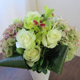 Flowers used: green roses, rusty green hydrangeas, chartreuse cymbidium orchids