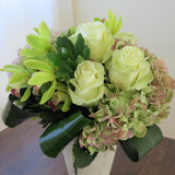 Flowers used: green roses, rusty green hydrangeas, chartreuse cymbidium orchids