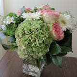 Flowers used: pink roses, rusty green hydrangeas, white daisies and white gerberas