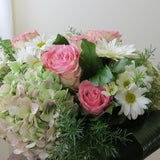 Flowers used: pink roses, rusty green hydrangeas, white daisies and white gerberas