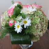 Flowers used: pink roses, rusty green hydrangeas, white daisies and white gerberas