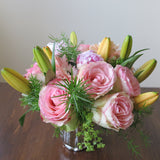 Flowers used: orange lilies, salmon pink roses and gerberas, pink peonies