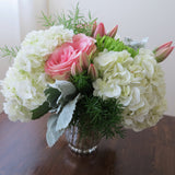 Flowers used: pink tulips and roses, green chrysanthemums, white hydrangeas