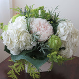 Flowers used: green roses, white hydrangeas, chartreuse lady's mantle, blush white peonies