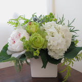 Flowers used: green roses, white hydrangeas, chartreuse lady's mantle, blush white peonies