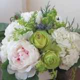 Flowers used: green roses, white hydrangeas, chartreuse lady's mantle, blush white peonies