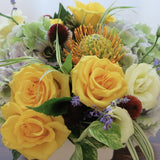 Flowers used: yellow roses, cream lisianthus, blue lavender, orange protea and rusty hydrangeas