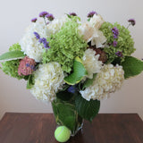 Flowers used: green and white hydrangeas, cream roses, white dahlias, blue verbena and lavender, pink sedums, hosta leaves