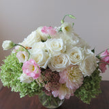 Flowers used: green hydrangeas, cream roses, white and blush pink dahlias, white and pink lisianthus, pink sedums