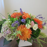 Flowers used: green hydrangeas, orange dahlias, white and pink lisianthus, pink turtleheads, green kales, pink sedums