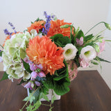 Flowers used: green hydrangeas, orange dahlias, white and pink lisianthus, pink turtleheads, green kales, pink sedums