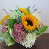 Flowers used: soft white and green hydrangeas, warm yellow sunflowers, rusty pink sedums