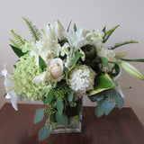 Flowers used: cream roses, white and green hydrangeas, white orchids, white lilies, green kales