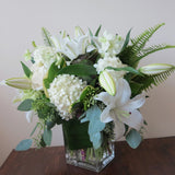 Flowers used: cream roses, white and green hydrangeas, white orchids, white lilies, green kales