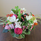 Flowers used: pink roses, orange ranunculus, white freesias, white Anne's Lace, pink hypericum berries