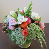 Flowers used: pink roses, orange ranunculus, white freesias, white Anne's Lace, pink hypericum berries