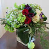 white and burgundy roses, green hydrangeas, purple anemone, blue lisianthus