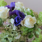 Flowers used: cream white roses, blue anemones, green hydrangeas, green viburnum, white lisianthus