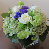 Flowers used: cream white roses, blue anemones, green hydrangeas, green viburnum, white lisianthus