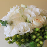 Flowers used: white roses, white lisianthus, green hypericum berries