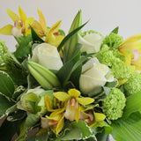 Flowers used: white roses, green viburnum, white lilies, yellow orchids