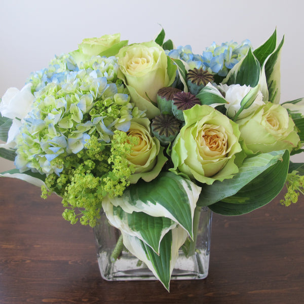 Flowers used: chartreuse roses, white lisianthus, blue blush hydrangeas, chartreuse lady’s mantles, poppy seed pods