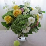Flowers used: green hydrangeas, yellow roses, white lisianthus, white orchids, pink sedums, green kales