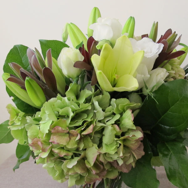 Flowers used: chartreuse lilies, green hydrangeas, white lisianthus