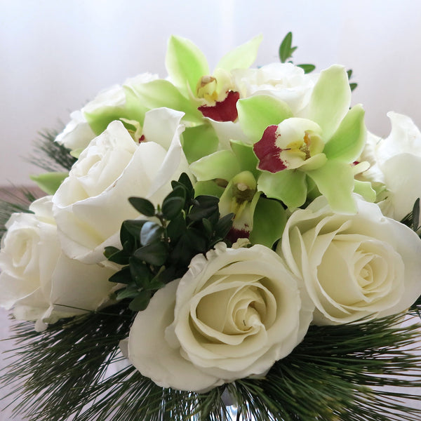 Flowers used: white roses, chartreuse cymbidium orchids
