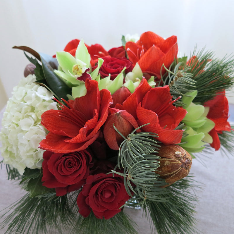 Flowers used: red roses, chartreuse cymbidium orchids, red amaryllis
