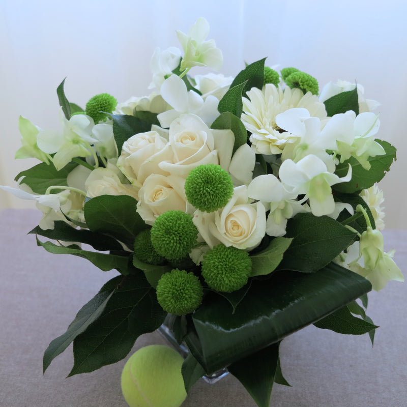Flowers used: white roses, white gerberas, white orchids, green mini mums
