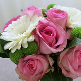 Flowers used: white gerberas, pink roses, green mini mums
