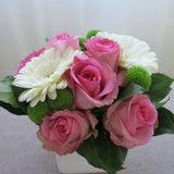 Flowers used: white gerberas, pink roses, green mini mums