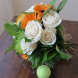 Flowers used: cream roses, orange gerberas, green mums