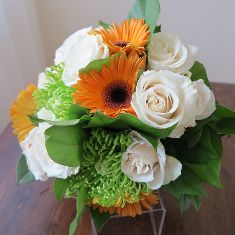 Flowers used: cream roses, orange gerberas, green mums