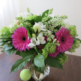 Flowers used: white freesias, lavender pink gerberas, white lilacs, green viburnums