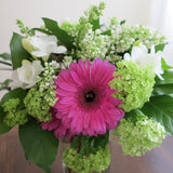 Flowers used: white freesias, lavender pink gerberas, white lilacs, green viburnums