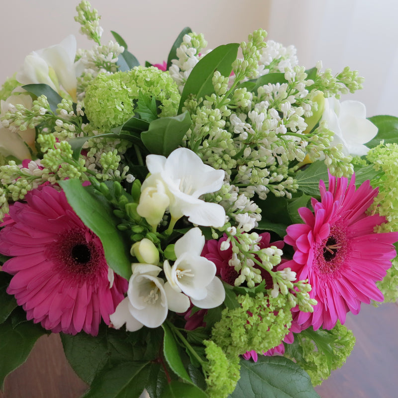 Flowers used: white freesias, lavender pink gerberas, white lilacs, green viburnums