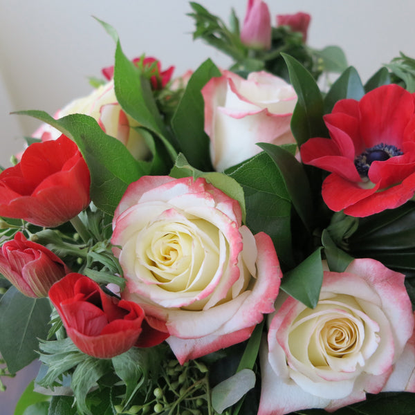 Flowers used: red blush roses, red hot anemones