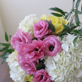 Flower used: soft yellow roses, pink lisianthus and white hydrangeas