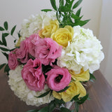 Flower used: soft yellow roses, pink lisianthus and white hydrangeas