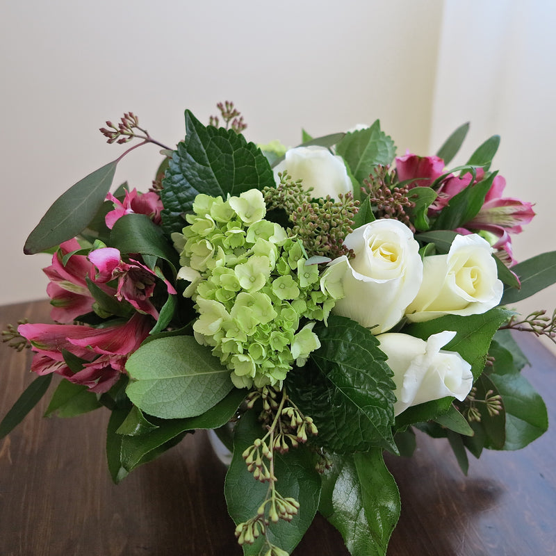 Flowers used: white roses, pink alstroemerias, green hydrangeas, seeded eucalyptus