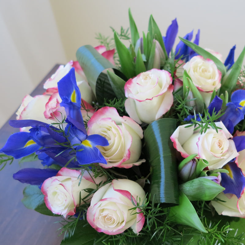 Flowers used: red blush roses, mauve tulips, blue irises