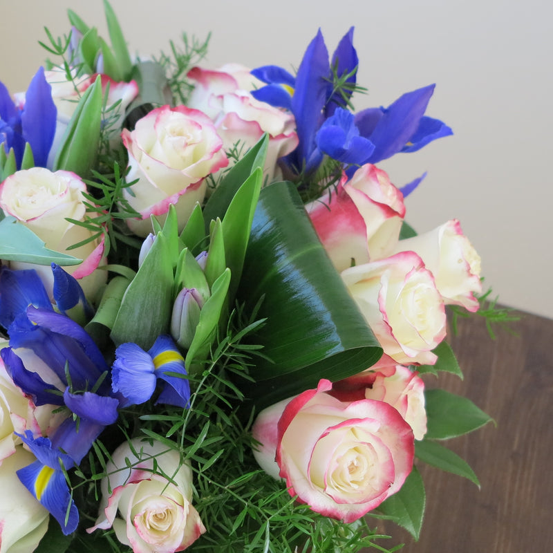 Flowers used: red blush roses, mauve tulips, blue irises