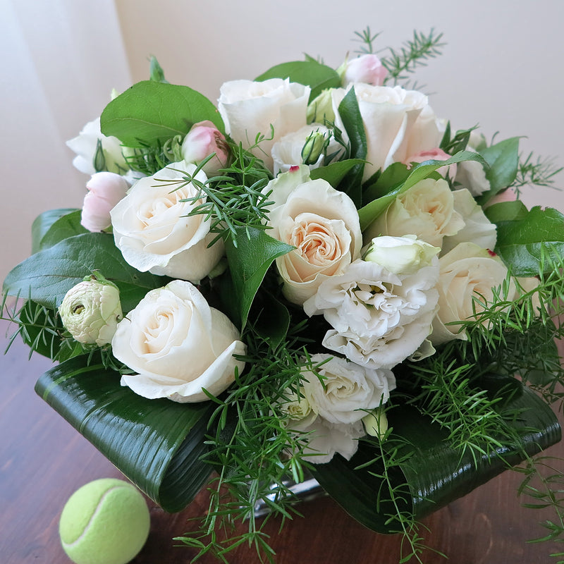 Flowers used: cream white roses, white lisianthus, pink ranunculus